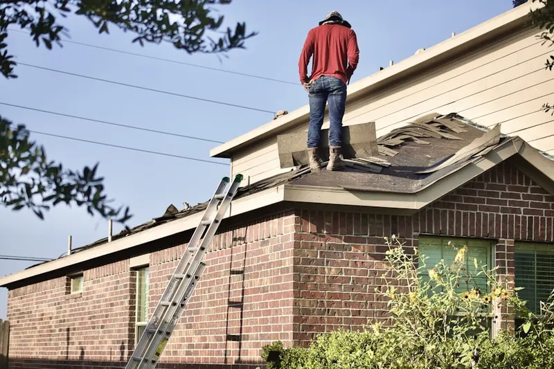 Professional roofer working on a residential roof in New Carlisle